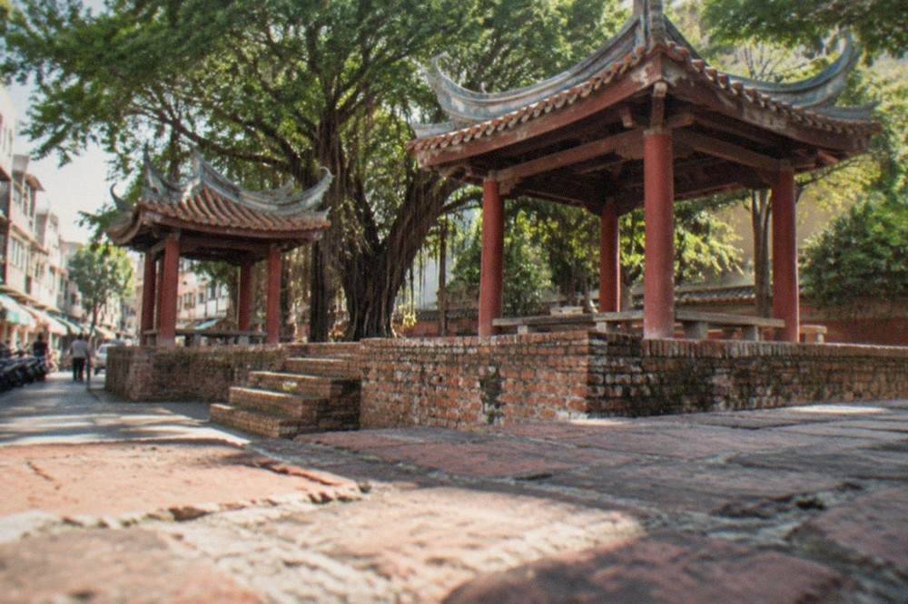 The red walls and tiled roofs of Chihkan Tower in the old city