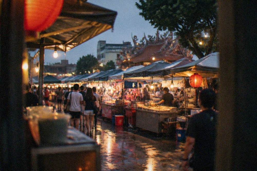 Lanterns and food stalls glowing at a busy Tainan night market