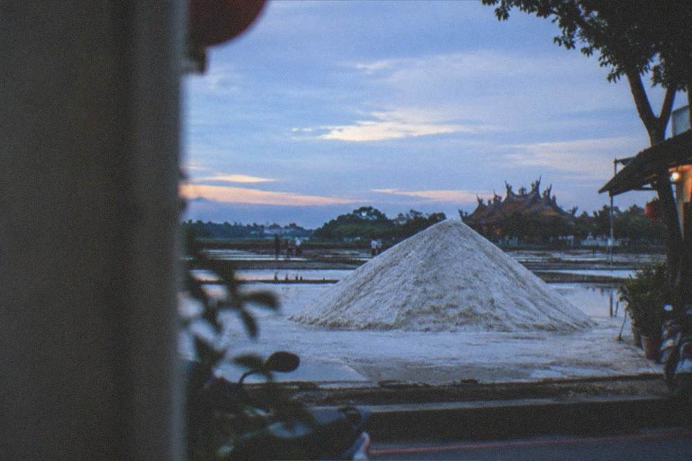 White salt mounds at Qigu Salt Mountain under a wide sky