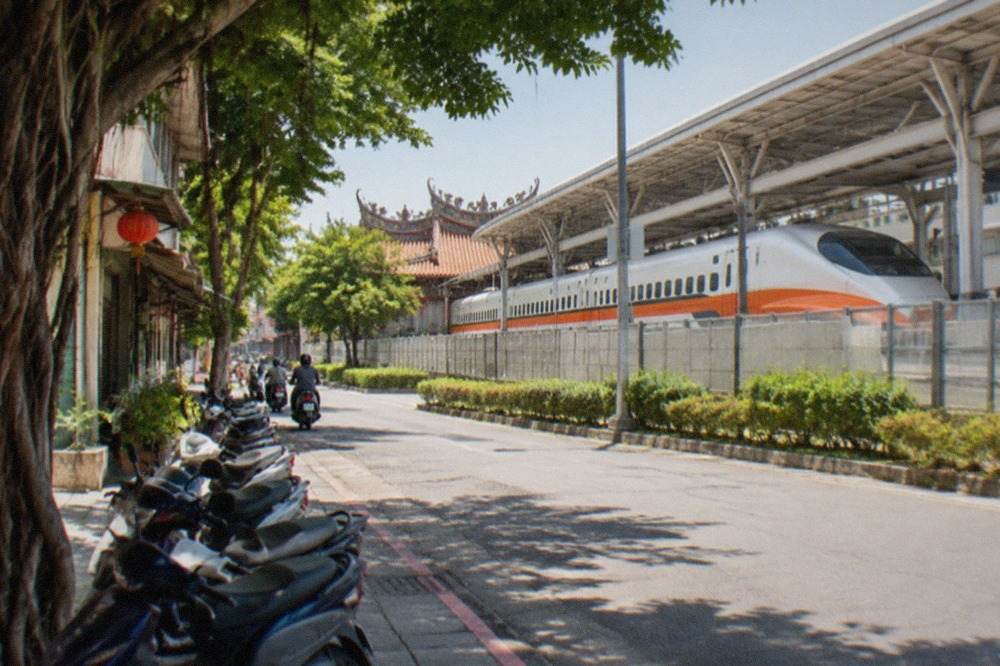 A high speed rail train waiting at a station platform in southern Taiwan