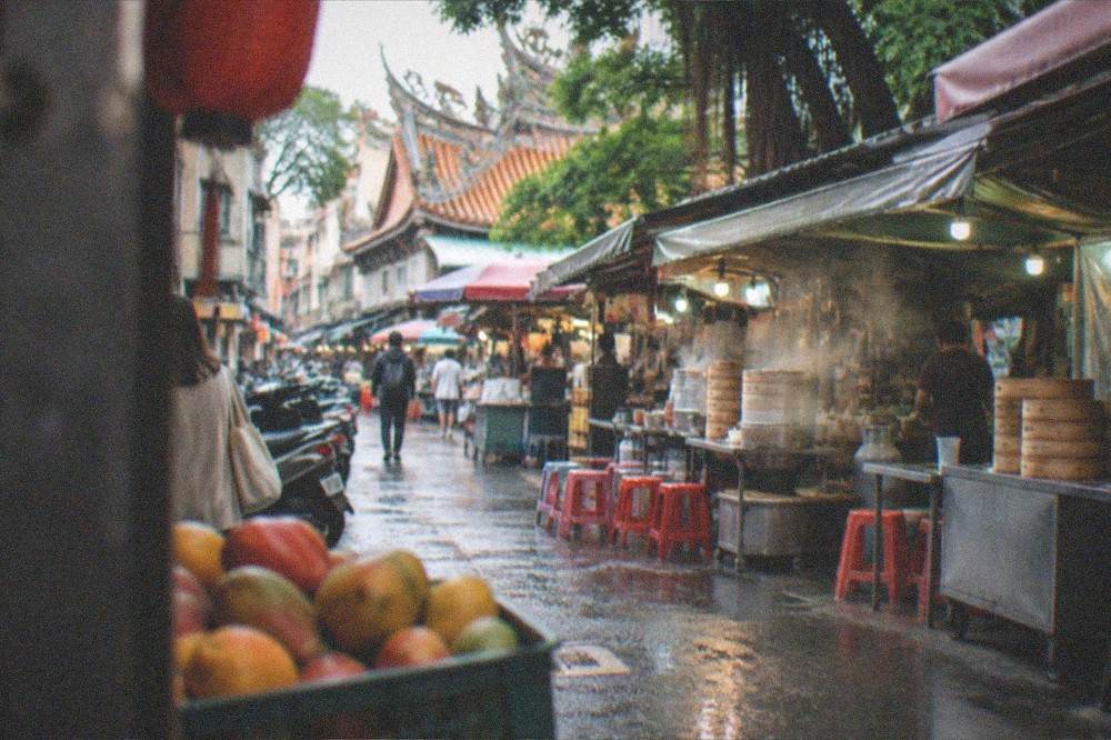 Mangoes stacked in a crate at a Taiwanese market stall