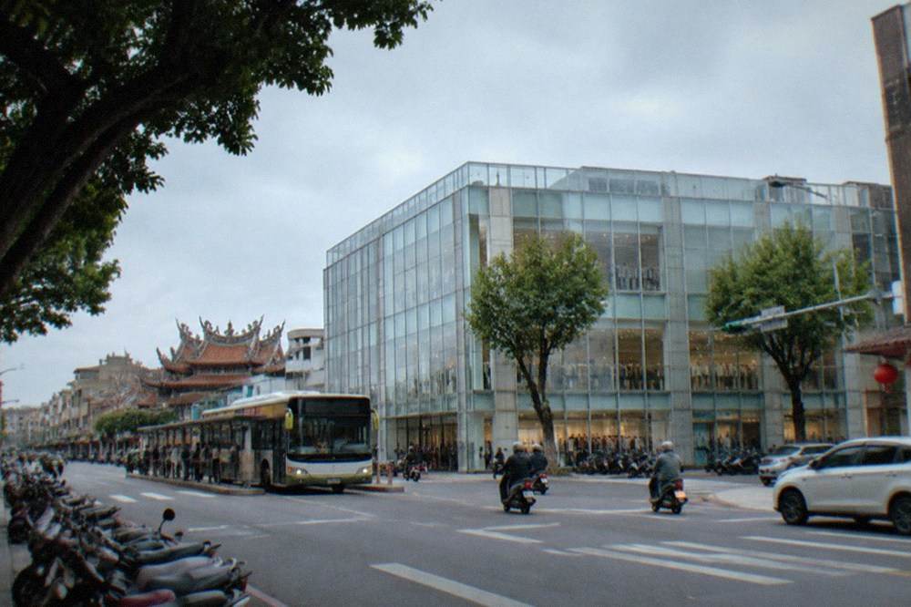 A city bus at a stop on a Tainan street