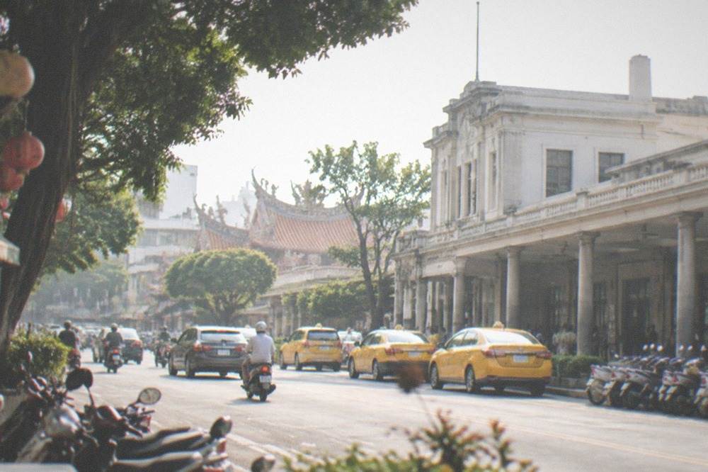 Grand museum building with columns and a wide plaza in daylight