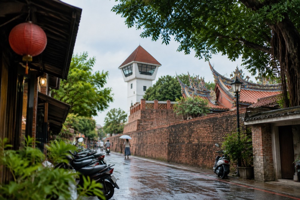 Old brick rampart walls and a white-washed lookout tower at Anping Old Fort