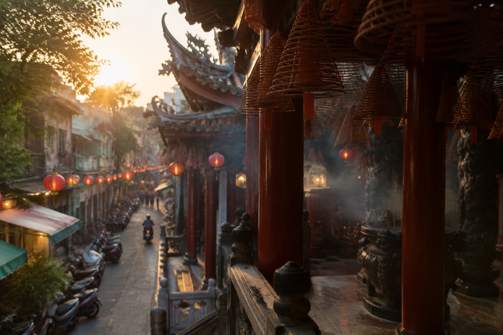 Lanterns glowing above a Tainan old street at dusk
